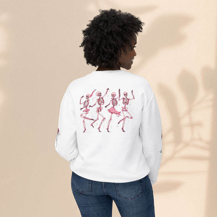 Sea Dragon Dreams white crewneck sweatshirt with pink dancing skeletons graphic worn by a woman from the back
