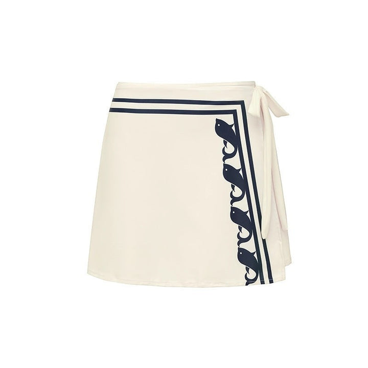 Sea Dragon Dreams white wrap skirt with navy blue nautical fish border and side tie detail