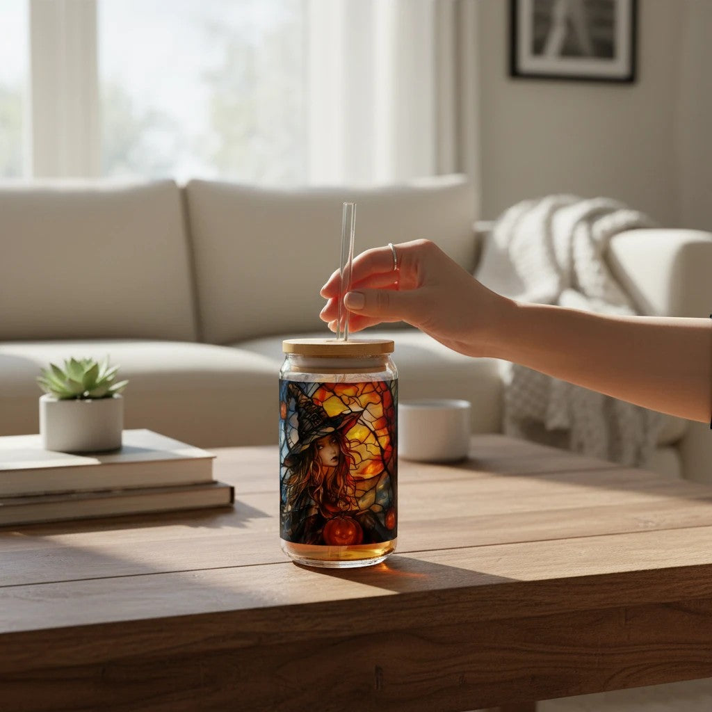 Sea Dragon Dreams 16oz Witches Brew glass with bamboo lid and straw on a wooden table in a bright living room