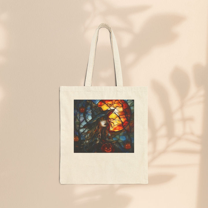 Sea Dragon Dreams cotton canvas tote bag featuring a witchy Halloween stained glass design on a natural background.