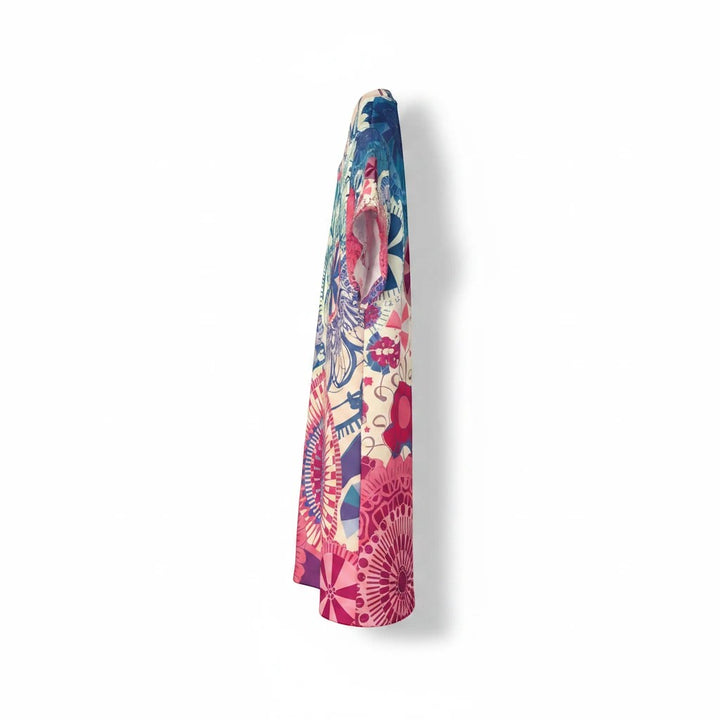 Sea Dragon Dreams women's sports jersey with vibrant multi-colored pattern, side view of moisture-wicking fabric.