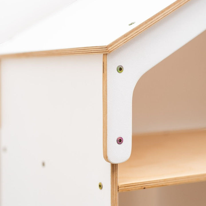 Sea Dragon Dreams white wooden dollhouse bookcase detail showing plywood edges and assembly screws