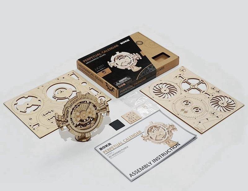 Sea Dragon Dreams wooden mechanical perpetual calendar 3D puzzle kit with laser-cut gear sheets and instructions