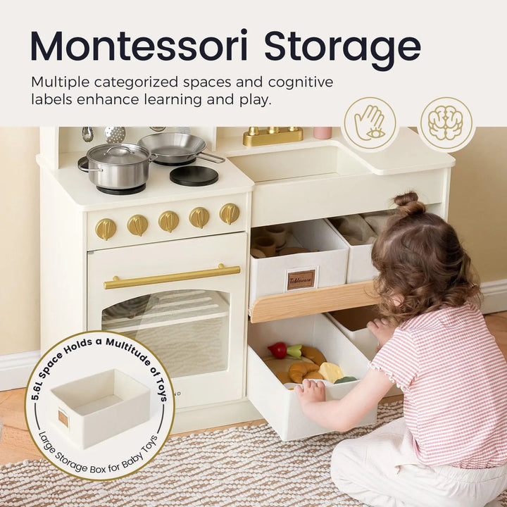 Sea Dragon Dreams Tiny Land wooden play kitchen in cream and sage with a toddler organizing toy storage bins