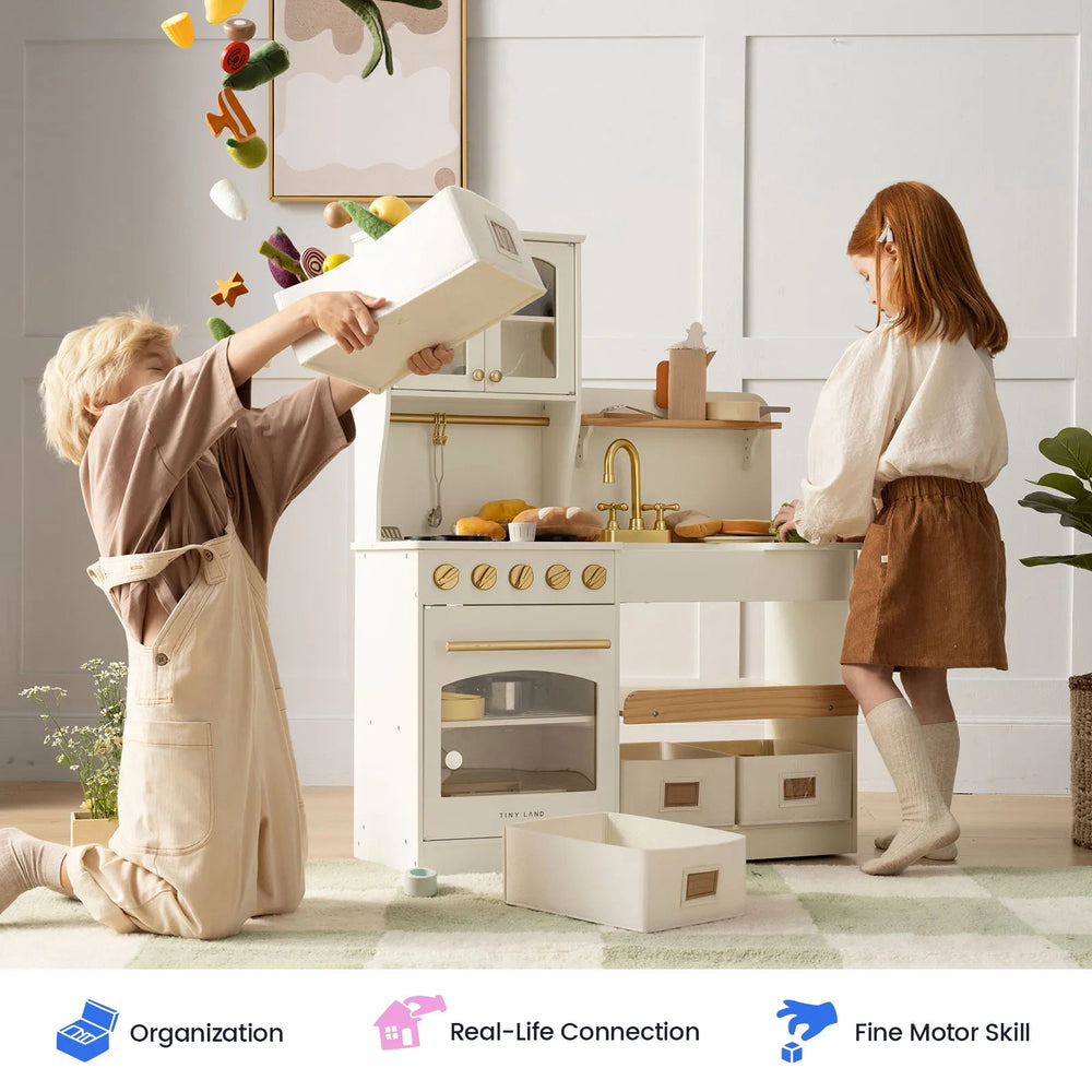 Sea Dragon Dreams Tiny Land wooden play kitchen in cream with children playing and pretend food in a bright playroom
