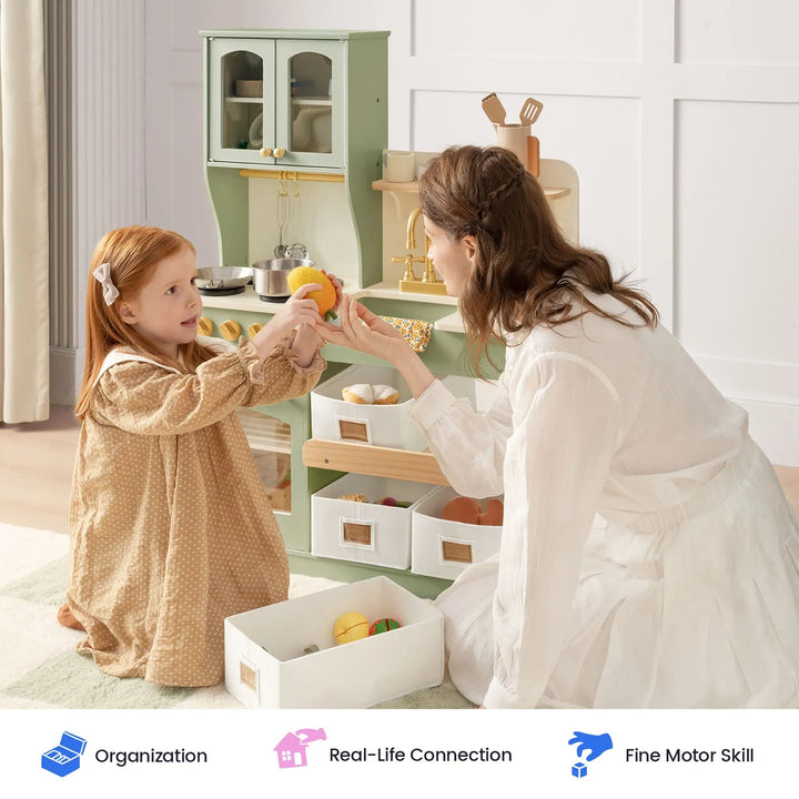 Sea Dragon Dreams Tiny Land wooden play kitchen in sage green with a mother and daughter playing together