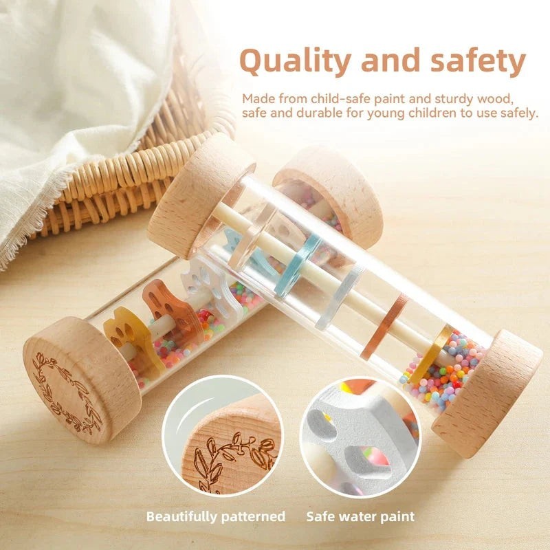 Sea Dragon Dreams Montessori wooden rain stick rattle with colorful beads and natural wood ends for sensory play.