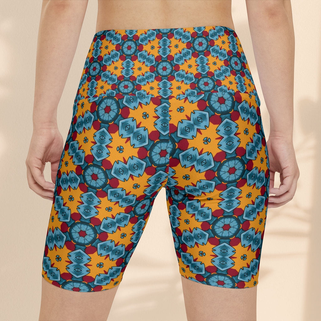 Sea Dragon Dreams women's workout shorts featuring a vibrant orange and blue street dragon geometric pattern.