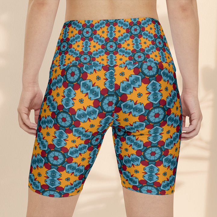 Sea Dragon Dreams women's workout shorts featuring a vibrant orange and blue street dragon geometric pattern.