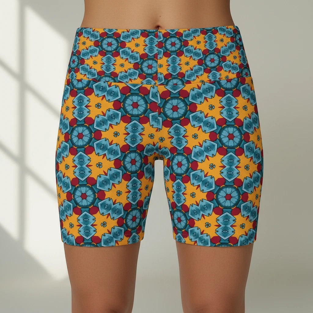 Sea Dragon Dreams women's workout shorts featuring a vibrant yellow, blue, and red street dragon geometric pattern.