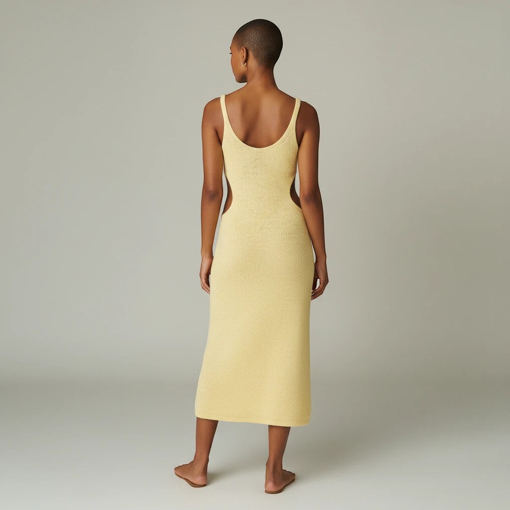 Sea Dragon Dreams backless yellow scoop neck cover-up dress with side cutouts on a model, back view