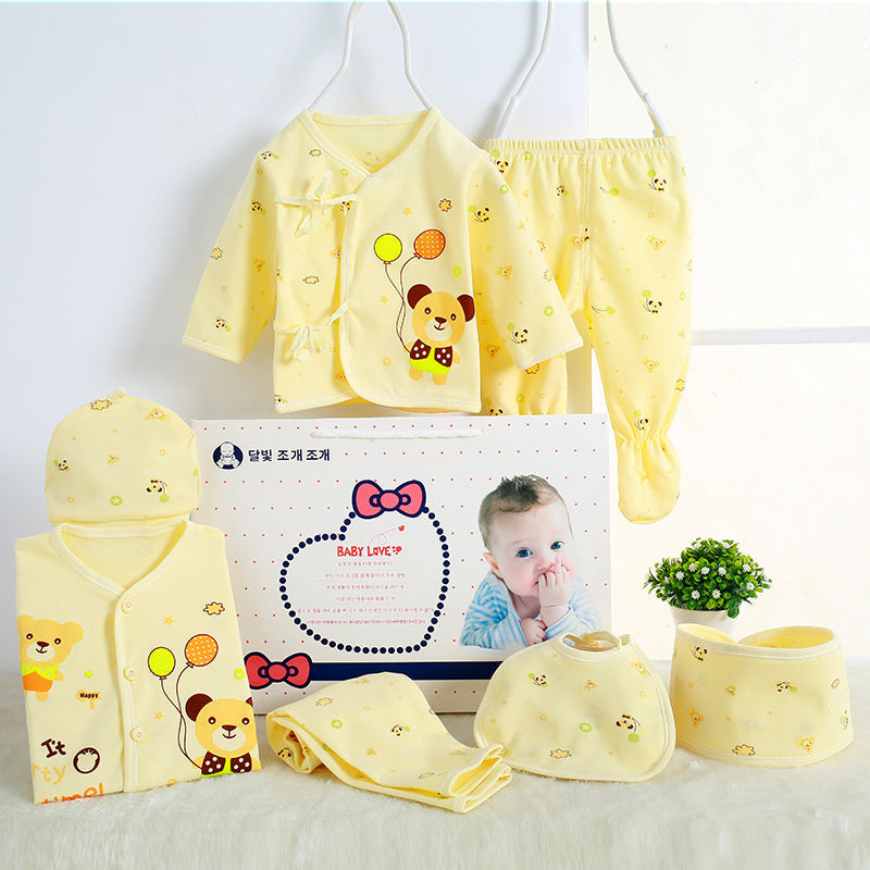 Sea Dragon Dreams newborn baby gift set in yellow cotton with cute bear prints, including clothing, hat, and bibs.