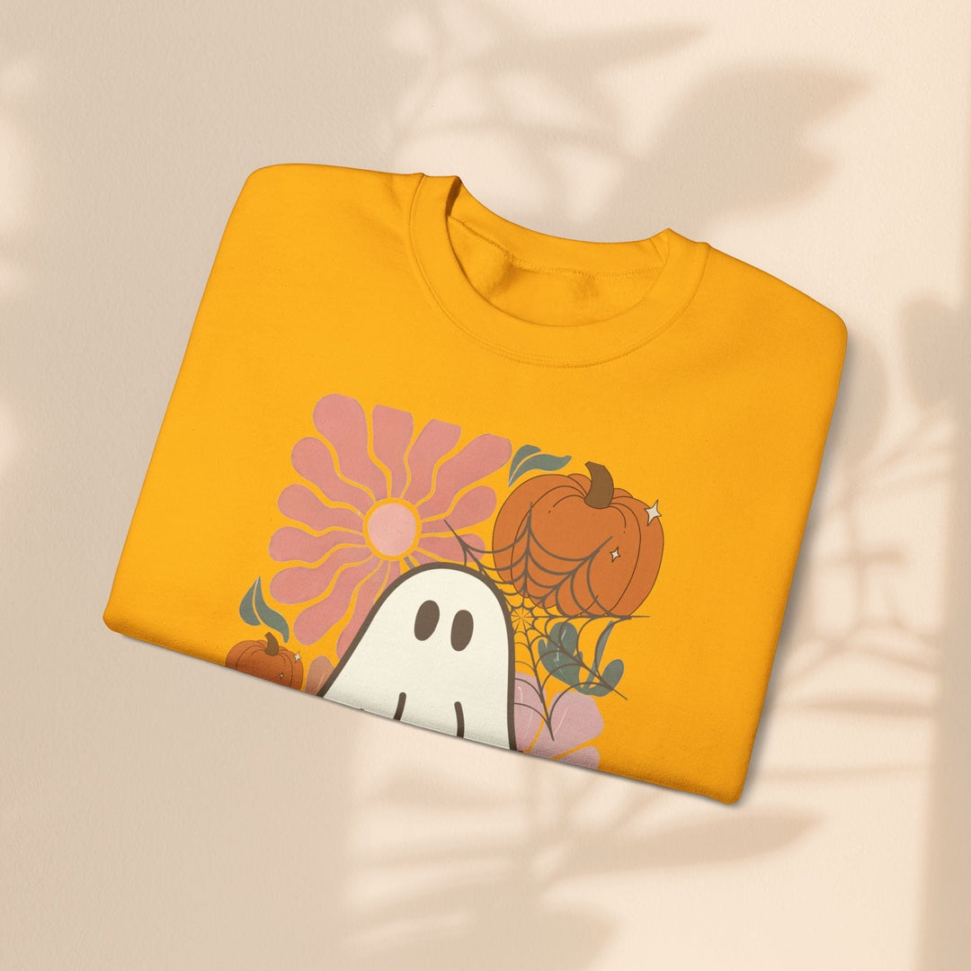 Sea Dragon Dreams yellow crewneck sweatshirt featuring a retro ghost, pumpkin, and flower graphic print.