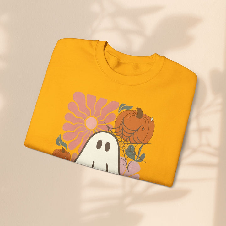 Sea Dragon Dreams yellow crewneck sweatshirt featuring a retro ghost, pumpkin, and flower graphic print.
