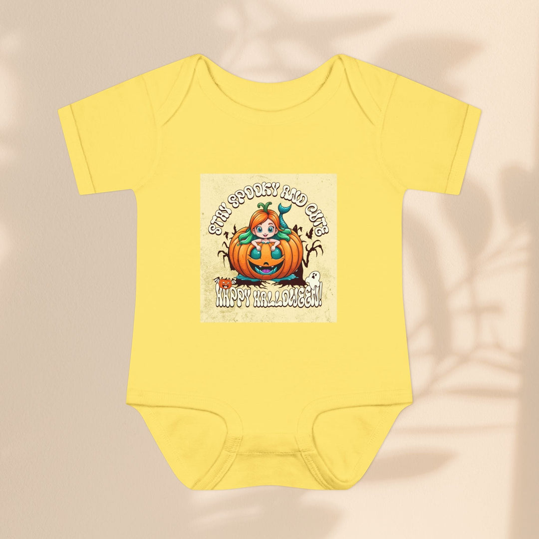 Sea Dragon Dreams yellow infant bodysuit with Stay Spooky and Cute pumpkin Halloween graphic print.