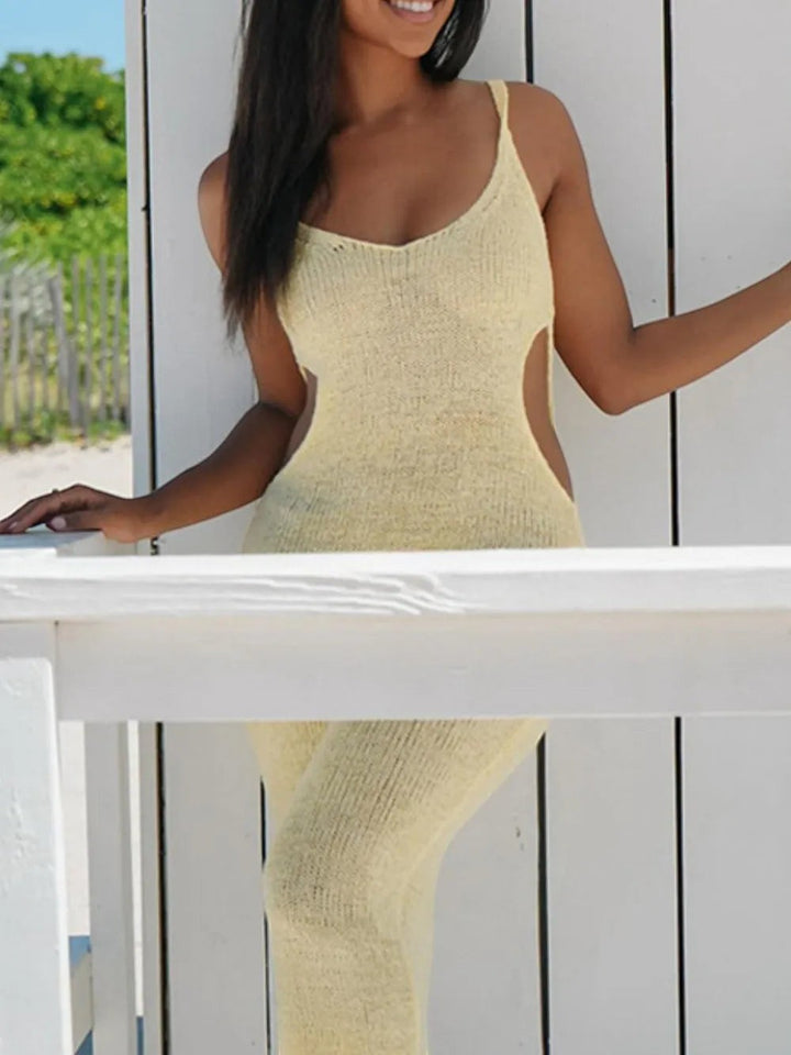 Sea Dragon Dreams backless yellow sheer knit cover-up dress with side cutouts and a scoop neckline on a beach model