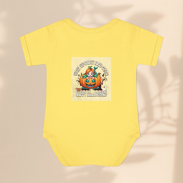 Sea Dragon Dreams yellow infant bodysuit with a Stay Spooky and Cute pumpkin Halloween graphic on the front.