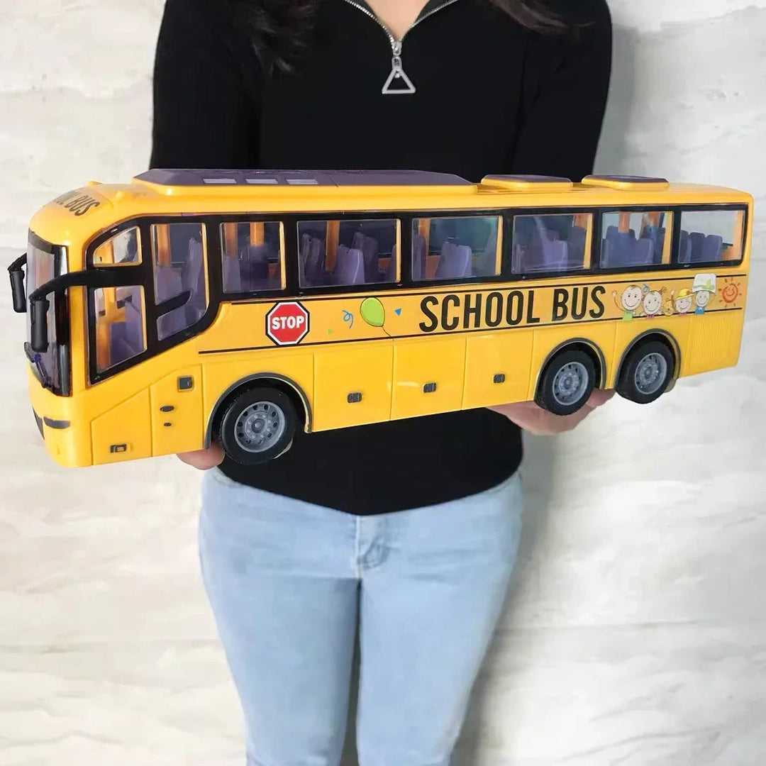 Sea Dragon Dreams 1:30 scale yellow school bus RC toy with realistic windows and graphics held by an adult