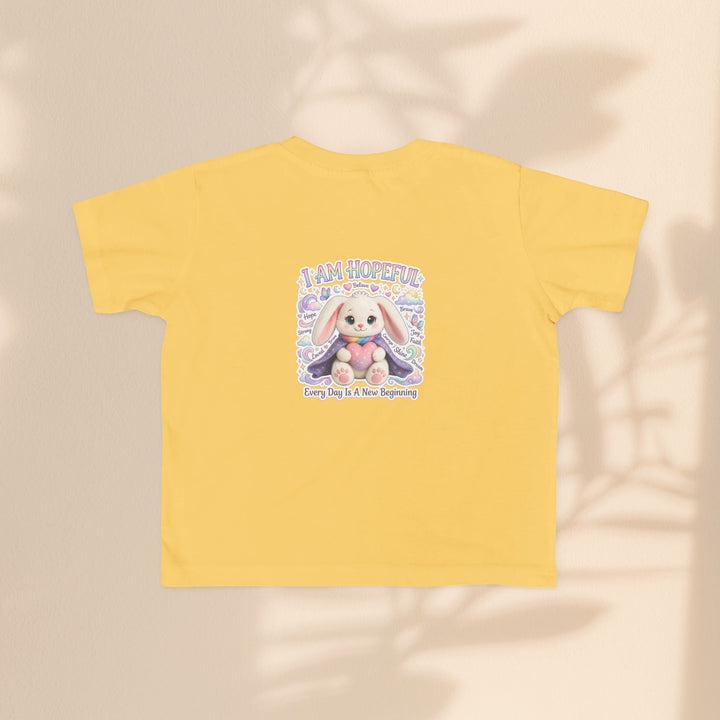 Sea Dragon Dreams yellow toddler t-shirt featuring a Hope Bunny graphic with the text I Am Hopeful.