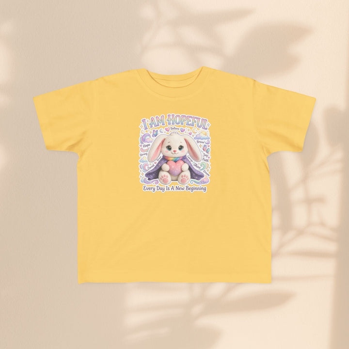 Sea Dragon Dreams yellow toddler tee featuring the Brave Buddies Hope Bunny with the text I Am Hopeful.