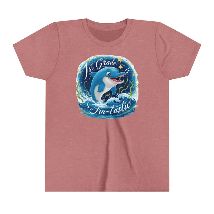 Sea Dragon Dreams youth short sleeve tee in heather mauve featuring a 1st Grade Fintastic dolphin graphic print.